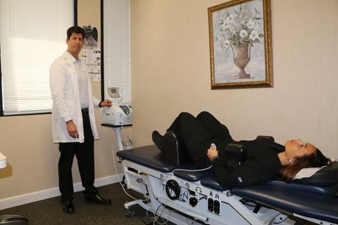 patient laying on decompression table in coral springs office