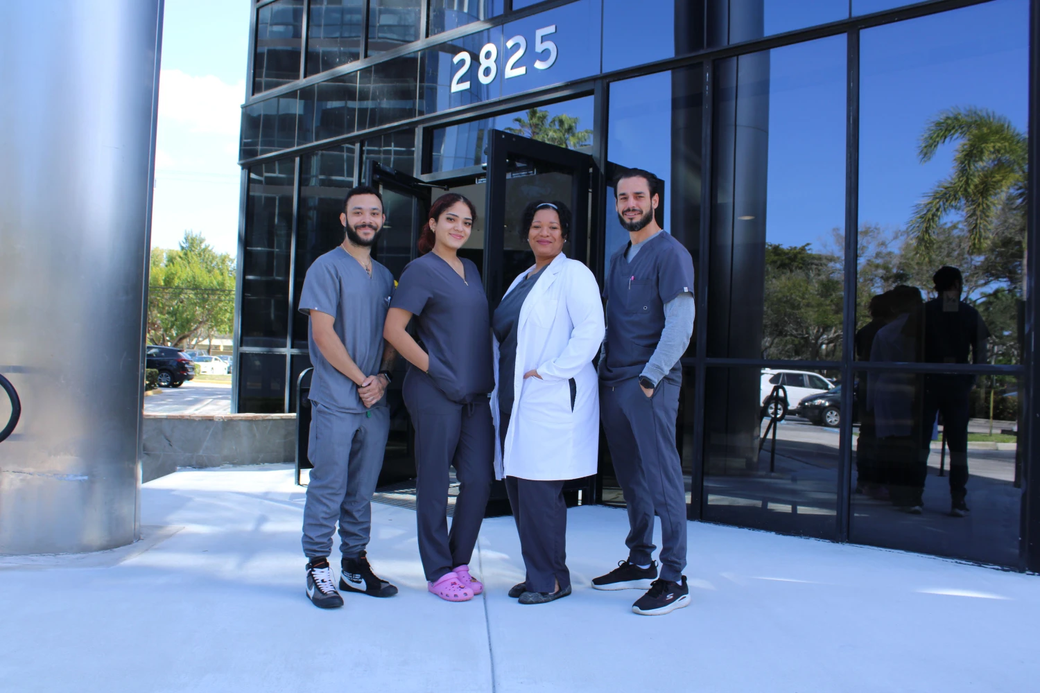 Coral Springs Chiropractic Team Standing Outside the Clinic