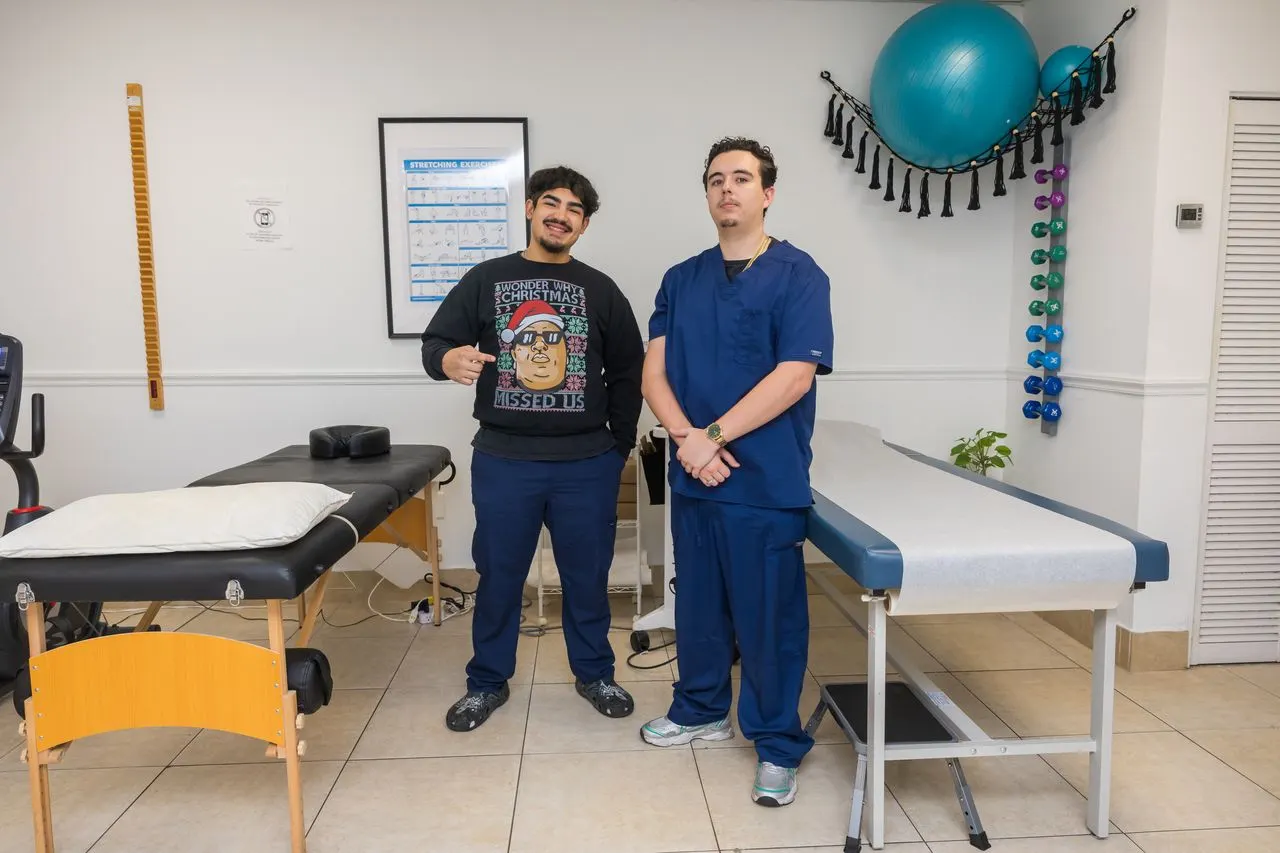 Back To Mind Kendall team celebrating with a recovered chiropractic patient in Miami, Florida