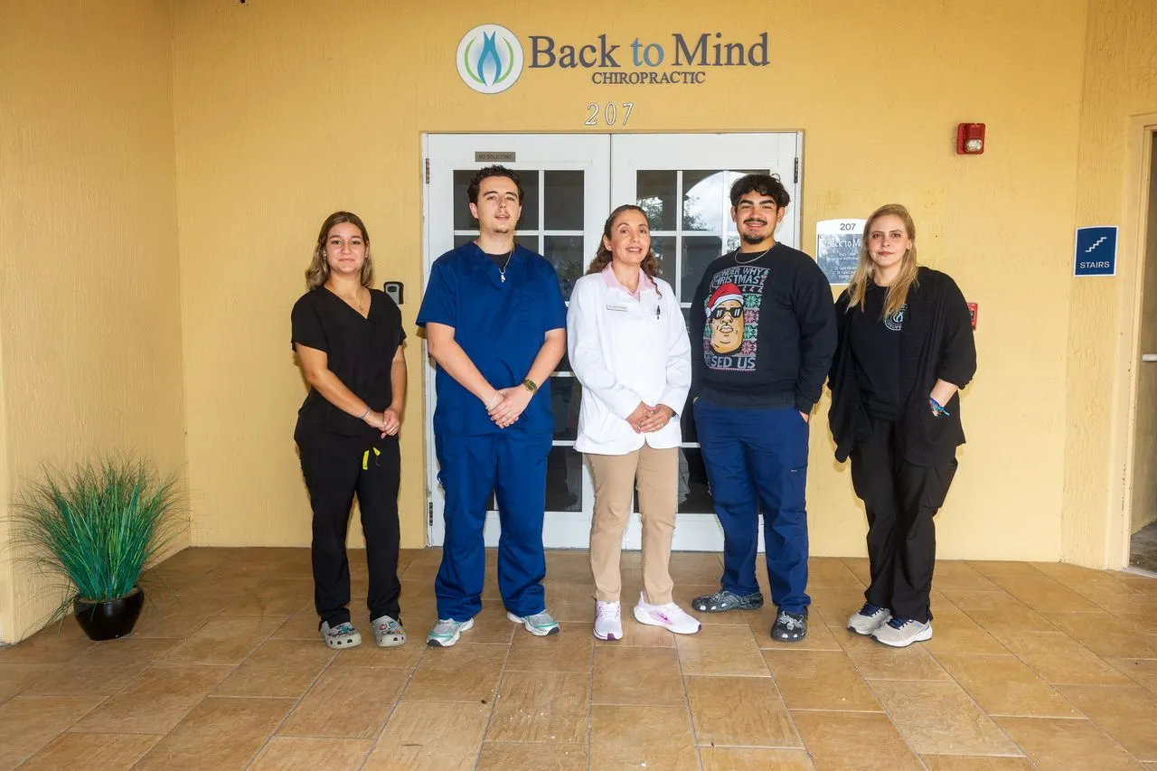 Back To Mind Injury Center Kendall office staff team at the front desk in Miami, Florida